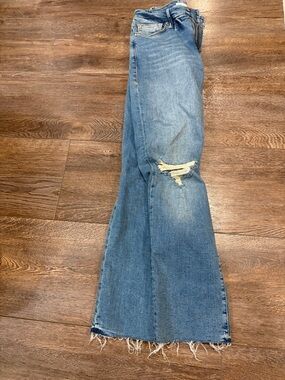 Good American distressed blue jeans